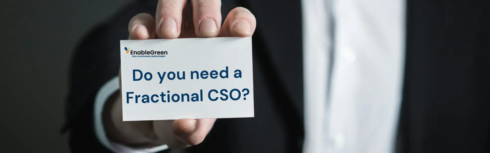 Hand holding an EnableGreen card asking "Do you need a Fractional Chief Sustainability Officer?
